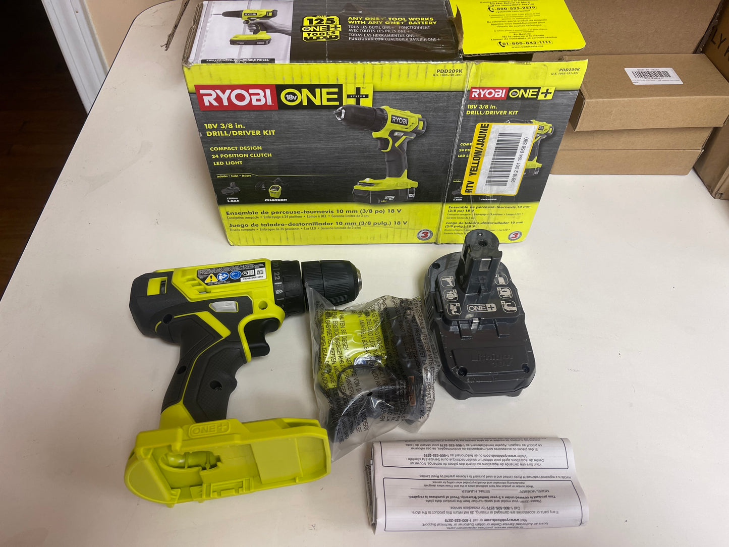 Ryobi One Plus 18V Cordless 3/8 in. Drill And Driver Kit with 1.5 Ah Battery and Charger Damaged Box
