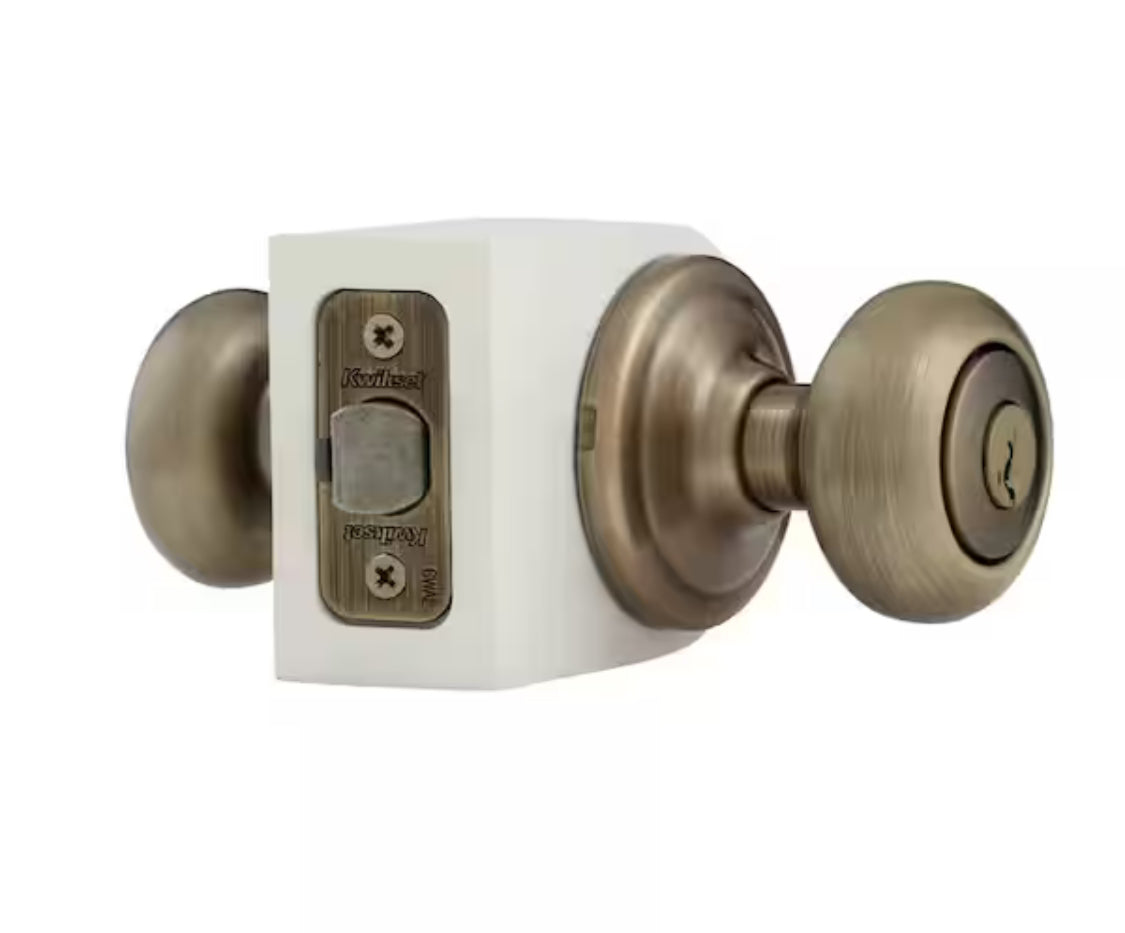 Kwikset Juno Antique Brass Entry Door Knob Featuring SmartKey Security with Microban Antimicrobial Technology