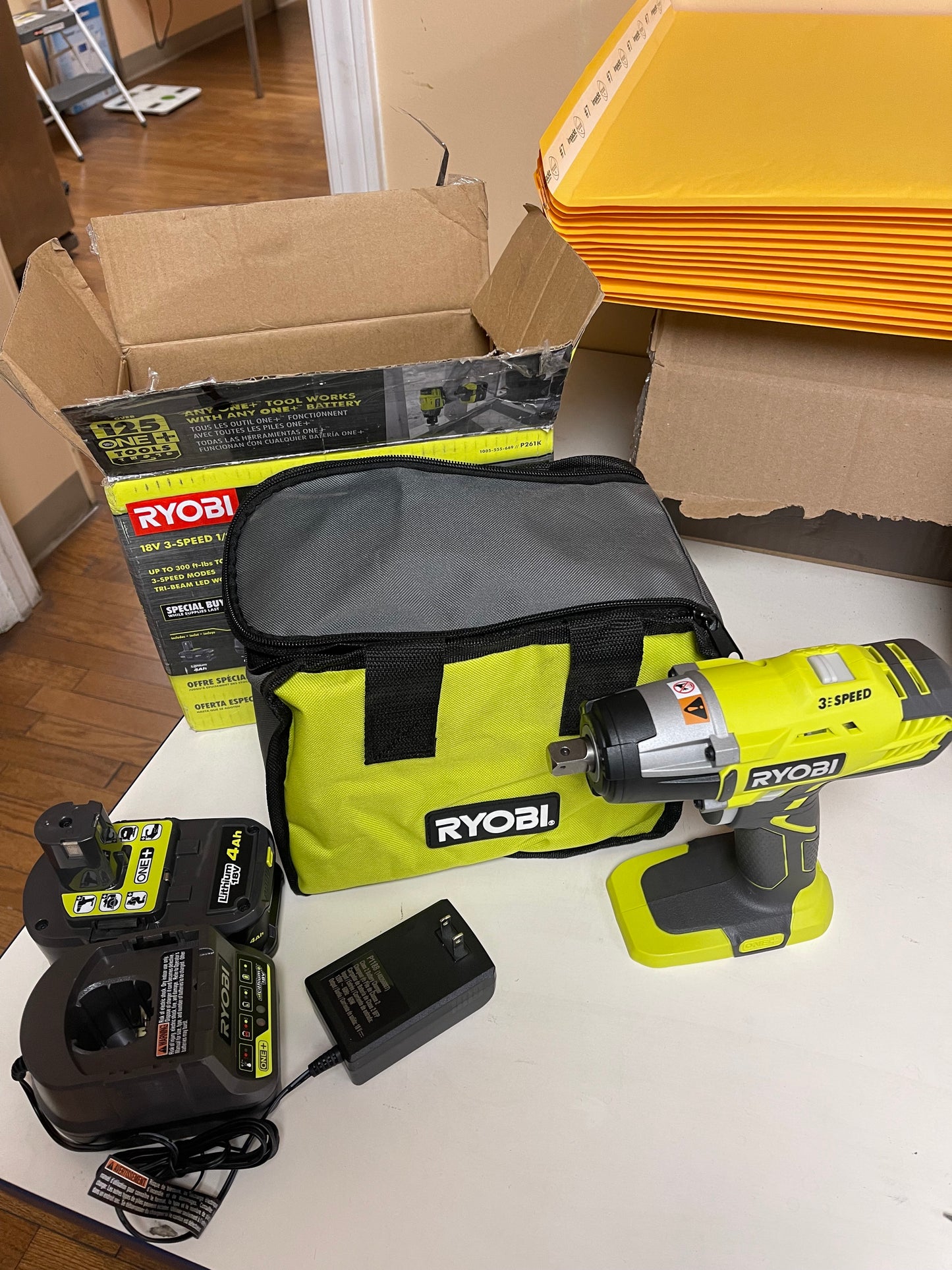 Ryobi 18V Cordless 3-Speed 1/2 in. Impact Wrench Kit with (1) 4 Ah Battery, Charger and Bag Damaged Box